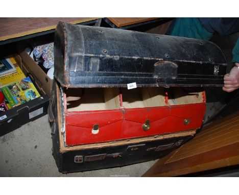 A large dome topped leather bound travel trunk with shoe compartments - 34" wide x 22" depth x 26" high.