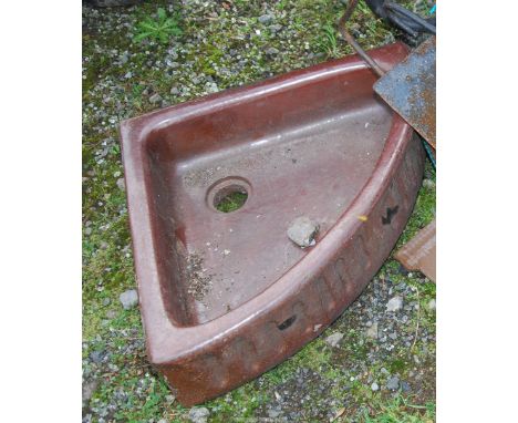 A Brown stoneware corner basin.