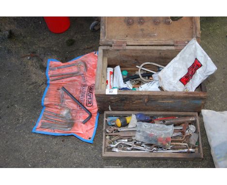 A wooden tool box, ring spanners, open-ended spanners, Kerosin nozzles, etc.