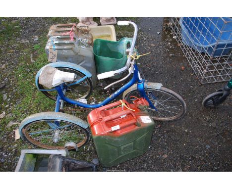 A tricycle and a Jerry can.