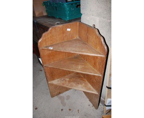 A corner shelf unit with three shelves, 38 1/2'' high x 26'' wide.