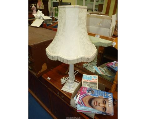 A table lamp and shade in cream and a quantity of Aston Villa programmes.
