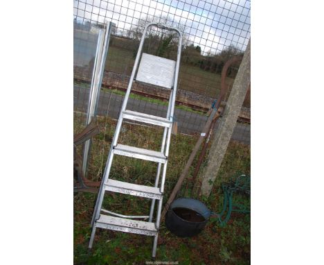 A five rung aluminium step ladder.