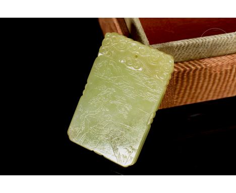 Jade of a smooth, uniform yellow hue, carved in the form of a rectangular plaque with a fine cut-out rim. Adorned with incise