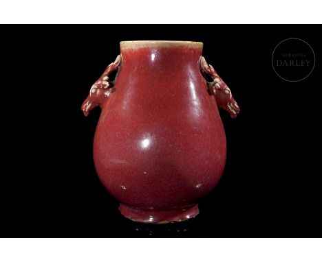Ceramic modelled in the form of a Hu vase, with a wide body, rounded belly and wide neck, flanked by two handles in relief in