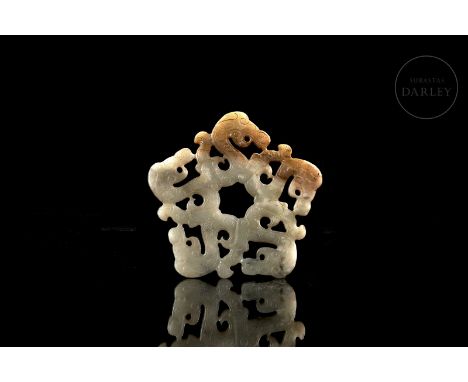 Carved jade, light-coloured with ochre and amber flecks. Carved in the form of five archaic dragons with coiled bodies, arran