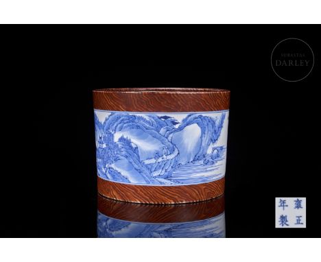 A cylindrical porcelain vessel decorated with a continuous central scene of a beautiful landscape of a lake and mountains wit