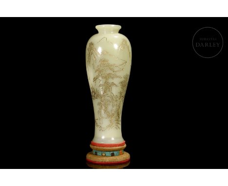 Jade of a soft cream tone. Carved in the form of a meiping vase, with a balustraded profile and a small turned mouth. Adorned