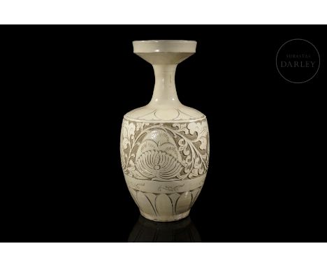 Ceramic modelled in the form of a vase, with a stylized body and a curved profile, tapering at the shoulders to a thin cylind
