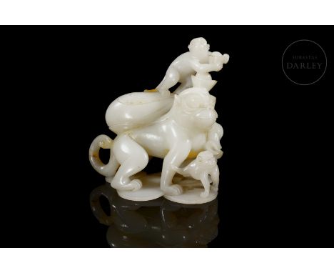 White jade with subtle amber flecks. Carved in the form of a large mother monkey, together with her two young, all arranged o