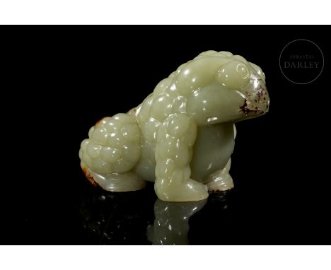 Jade of a light greenish hue, with intense reddish flecks. Carved in the shape of a toad, in a seated position, with its legs