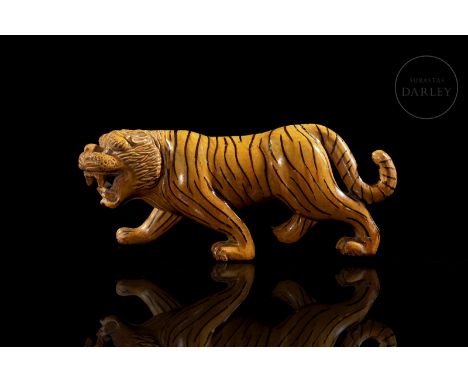 Ceramic modelled in the form of a ferocious tiger. It walks on its four sturdy legs, with a curled tail and an intimidating e