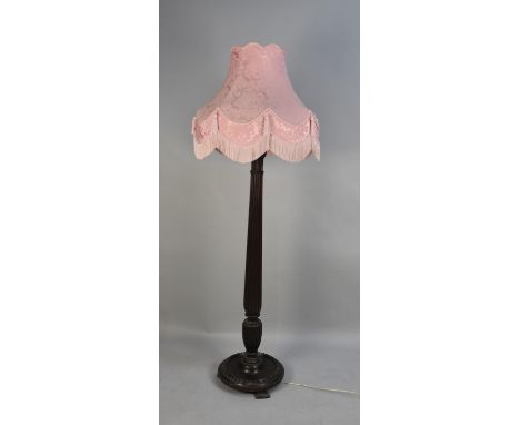 An Edwardian Standard Lamp with Reeded Column Support and Circular Base, Complete with Pink Shade 