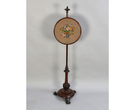A  Victorian Mahogany Rise and Fall Pole Screen with Circular Tapestry Panel on Circular Base with Three Scrolled Feet 