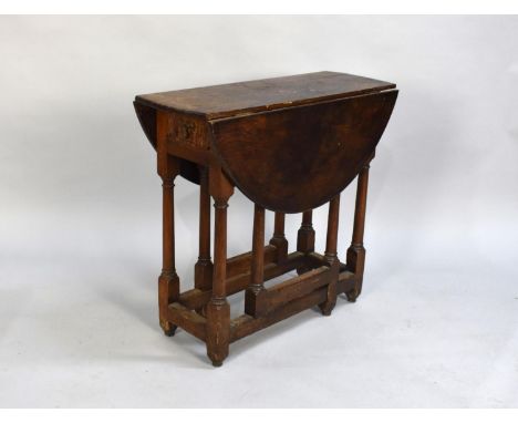 A Late 19th Century Small Oak Circular Topped Gate Leg Drop Leaf Table, Single End Drawer, 75cms Long 