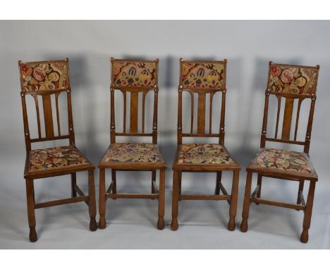A Set of Four Edwardian Oak Dining Chairs with Tapestry Top Rails and Matching Seats 