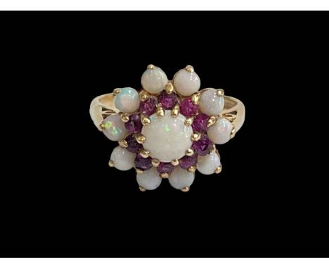 Opal and amethyst petal design ring set in 9 carat yellow gold, size R.