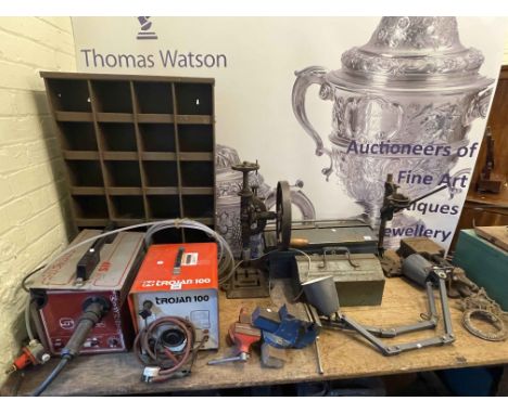 Mig and Arc welders, bench grinder, various tools, cabinets and work bench.