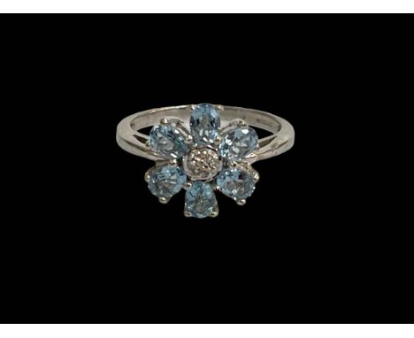 9 carat white gold petal design topaz and diamond ring, size J.