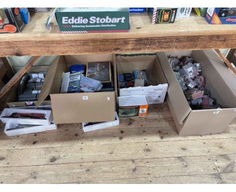 Four boxes of model railway accessories including N Gauge track, buildings, controllers, four Atlas? model trains, etc.