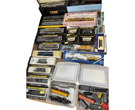 Collection of Graham Farish N Gauge model trains and carriages including steam and diesel locomotives.