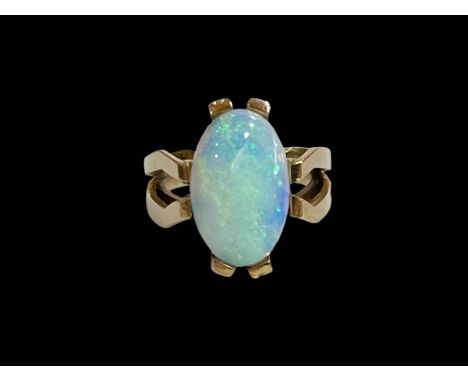 Large oval opal ring set in 14 carat yellow gold, size L.