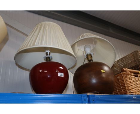 A wooden table lamp and shade together with another table lamp