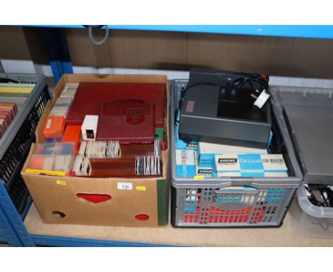 A Hanimex auto focus projector, various slide magazines, and a box containing various slides etc.