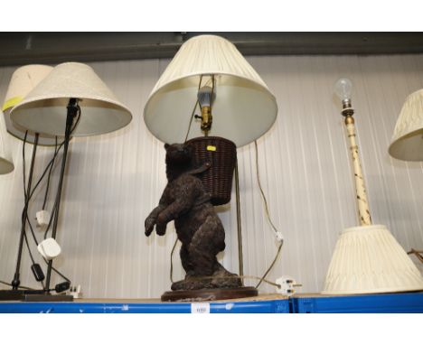 A figural table lamp in the form of a bear and shade 