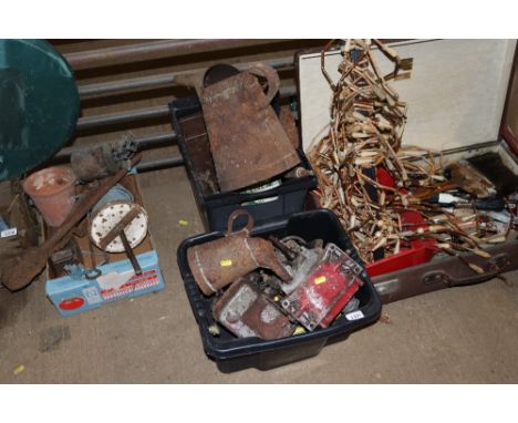 Two plastic crates containing vintage oil can, shoe last and various tools