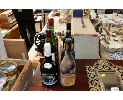 Six bottles of alcohol to include White Mist, Cockburns, Always Scotch Whisky etc.