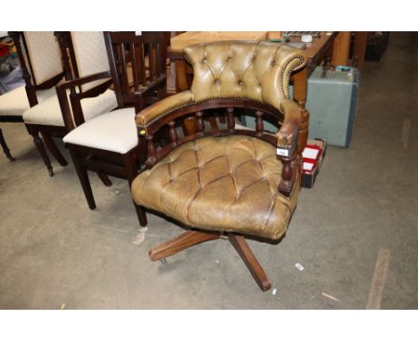 A button down upholstered swivel desk chair
