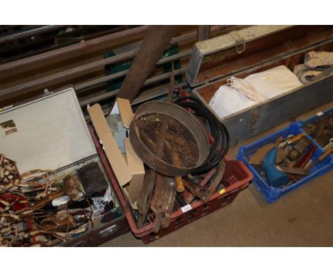 A plastic crate and contents of various hand tools, sieve, scythe blades etc
