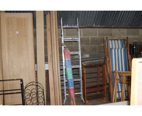 A wind break and an aluminium step ladder
