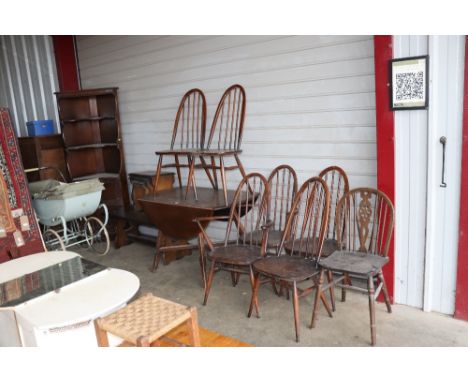 A quantity of dark Ercol furniture to include stick back chairs, nest of three table, coffee table, drop leaf table, corner u