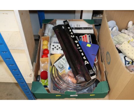 A box containing various games, playing cards etc.