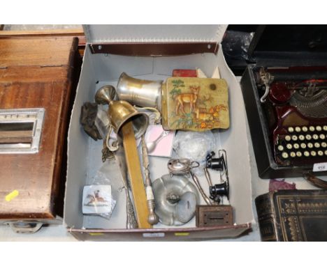 A box containing silver plated trophy cups, tankard, shoe horn, button hook etc.