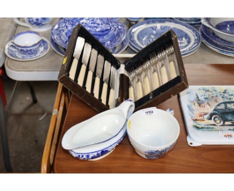 A cased set of six each of silver plated fish knives and forks, a Myott and Sons sauce boat and a Myott breakfast cup