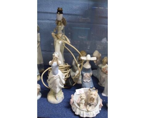 Extensive group of Lladro style figures and a lamp base (a/f)   