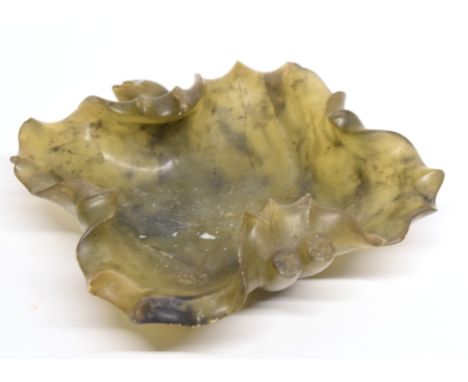 Spinach green jade dish with a carved bud handle and lobed shape