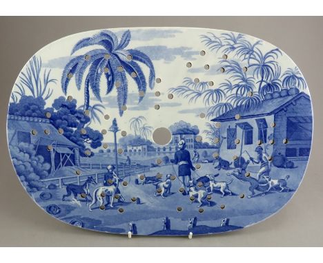 An early nineteenth century blue and white transfer-printed Spode Indian Sporting series drainer, c.1810. It is marked to the