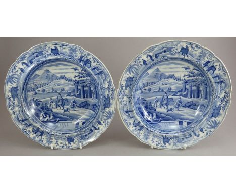 A pair of early nineteenth century blue and white transfer-printed Spode Caramanian series soup dishes, c.1810. They are mark