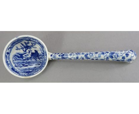 An early nineteenth century blue and white transfer-printed Spode Caramanian series sauce ladle, c.1810. It is marked to the 