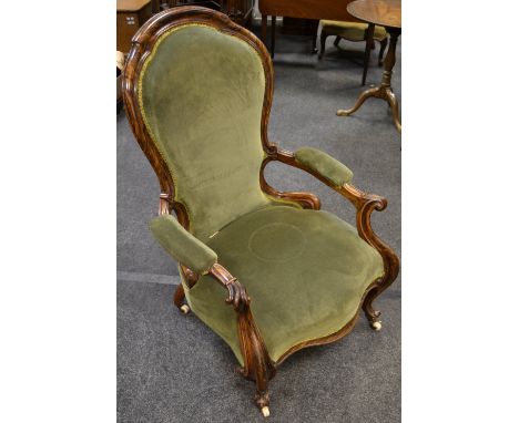 A Victorian Rosewood open arm salon chair, padded back, outswept arms, knurled terminals, serpentine stuffed overseat, cerami