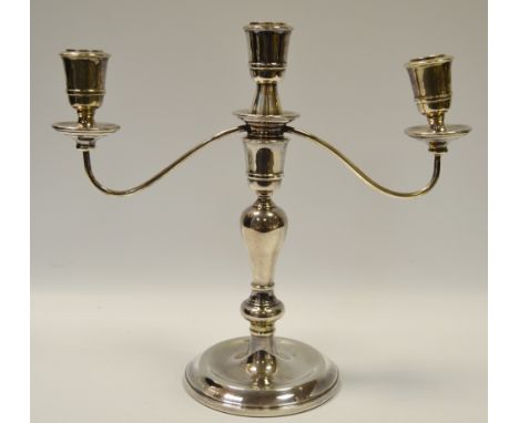 A modern silver three light two branch silver candlestick