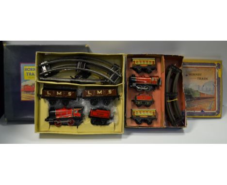 Hornby 0 Gauge - a boxed M1 clockwork Goods Set comprising 0-4-0 engine red, tender no.3435, two LMS wagons, track; another M