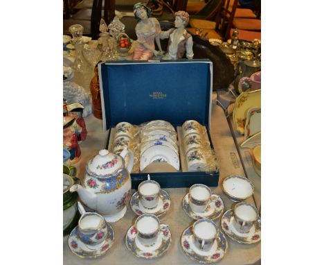 A Royal Worcester coffee set for six cans and saucers (boxed); a Coalport coffee set comprising coffee pot, creamer, sucrier,