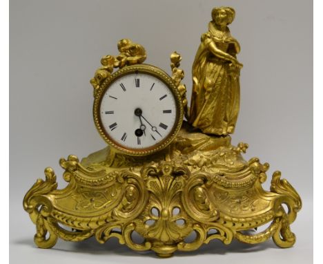 A French gilt metal figural mantel clock by Japy Freres featuring an Elizabethan lady, enamelled dial, Roman numeral.