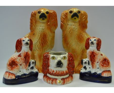 A pair of 19th century Staffordshire spaniel mantel dogs, recumbent spaniel to base; a Staffordshire double headed spaniel po