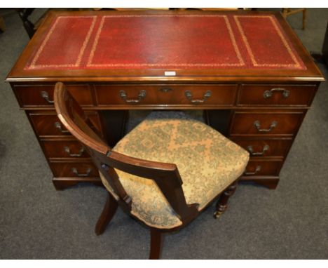 A 20th Century tooled leather inlaid pedestal kneehole desk by William Lawrence; a Victorian spoon back Library chair, brass 